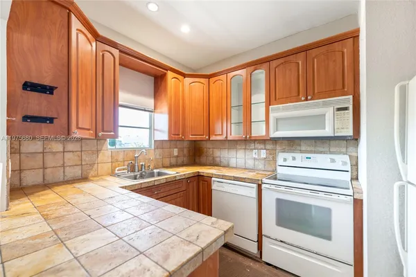 a close view of a utility room with washer and dryer