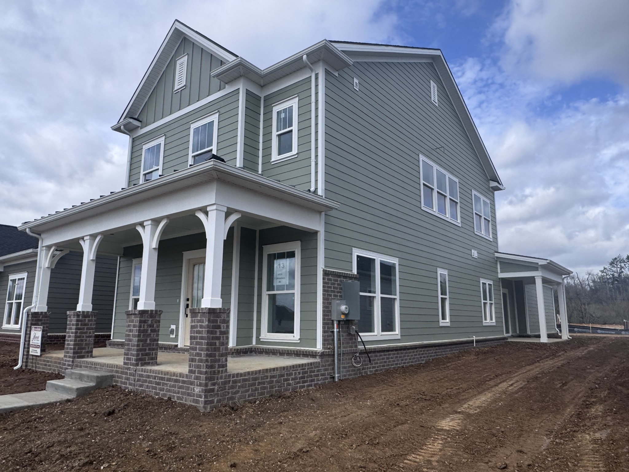 1825 Flatwaters St Spring Hill Spring Hill, TN 37174 - Photo 2 of 6 a front view of a house with a yard