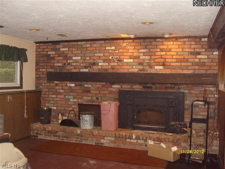 6009 Collins Road Mentor, OH 44060 - Photo 12 of 25 BEAUTIFUL WOOD BURNING FIREPLACE IN FAMILY ROOM