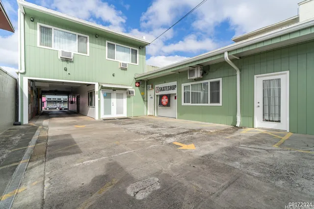 a front view of a house with a yard and a garage