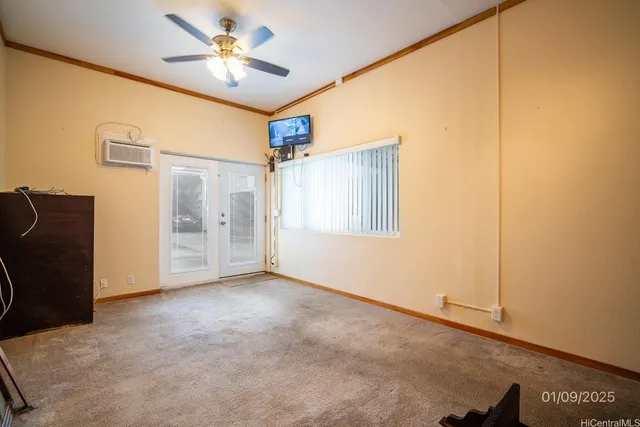 a view of empty room with a ceiling fan