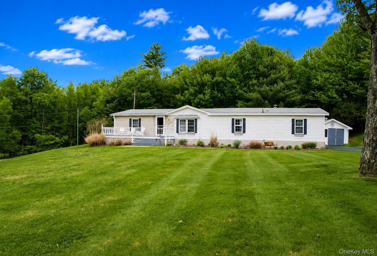 502 Myers Road Neversink, NY 12765 - Photo 4 of 38 a front view of a house with garden