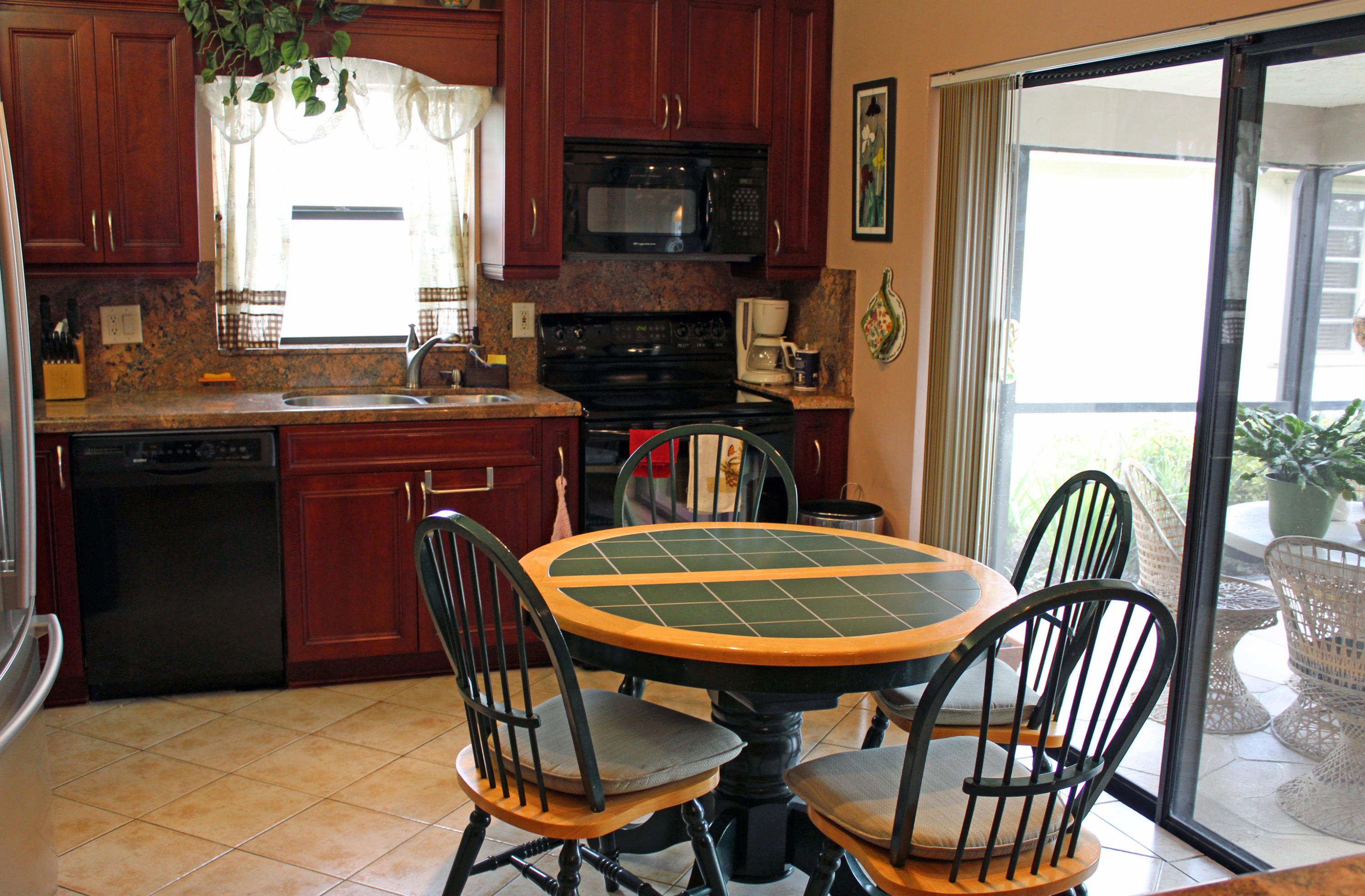8963 Old Pine Way Boca Raton, FL 33433 - Photo 20 of 31 Kitchen w patio views