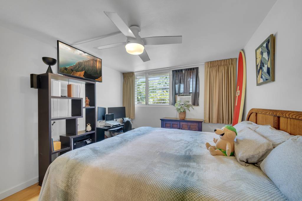 4156 Rice Street, Unit 107 Lihue, HI 96766 - Photo 13 of 29 a bedroom with a bed window and dresser