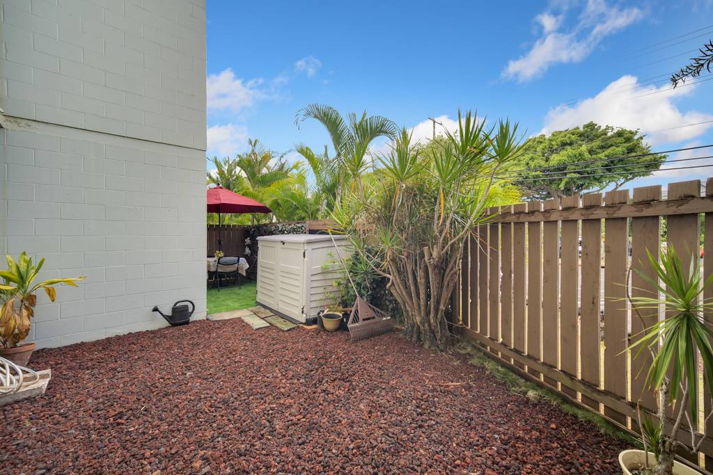 4156 Rice Street, Unit 107 Lihue, HI 96766 - Photo 23 of 29 a view of a house with a backyard