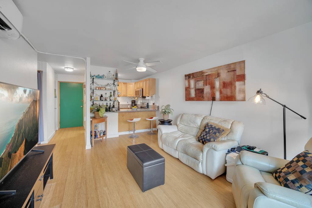 4156 Rice Street, Unit 107 Lihue, HI 96766 - Photo 24 of 29 a living room with furniture and a flat screen tv