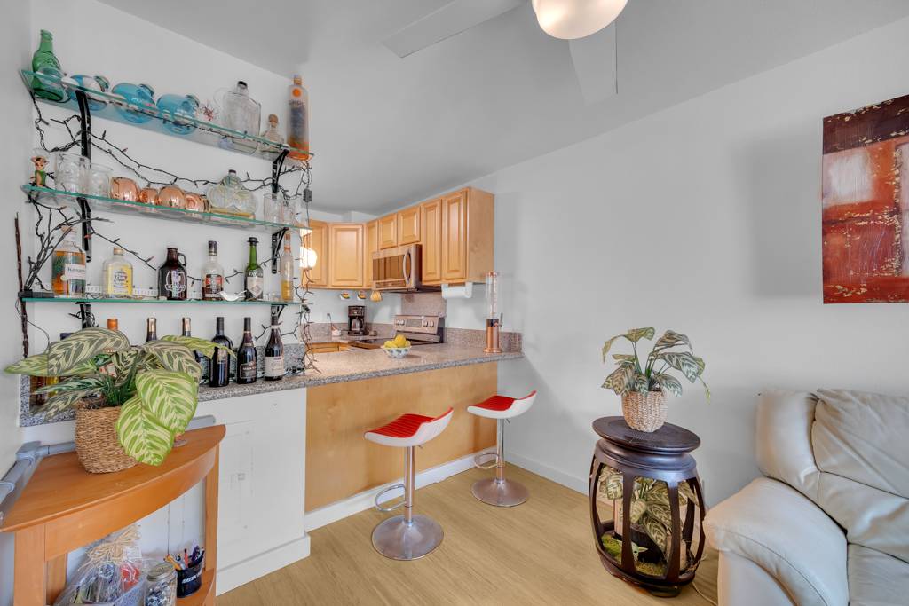 4156 Rice Street, Unit 107 Lihue, HI 96766 - Photo 4 of 29 a room with furniture a rug and flowers