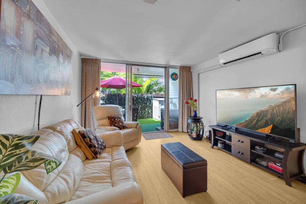 4156 Rice Street, Unit 107 Lihue, HI 96766 - Photo 5 of 29 a living room with furniture and a flat screen tv