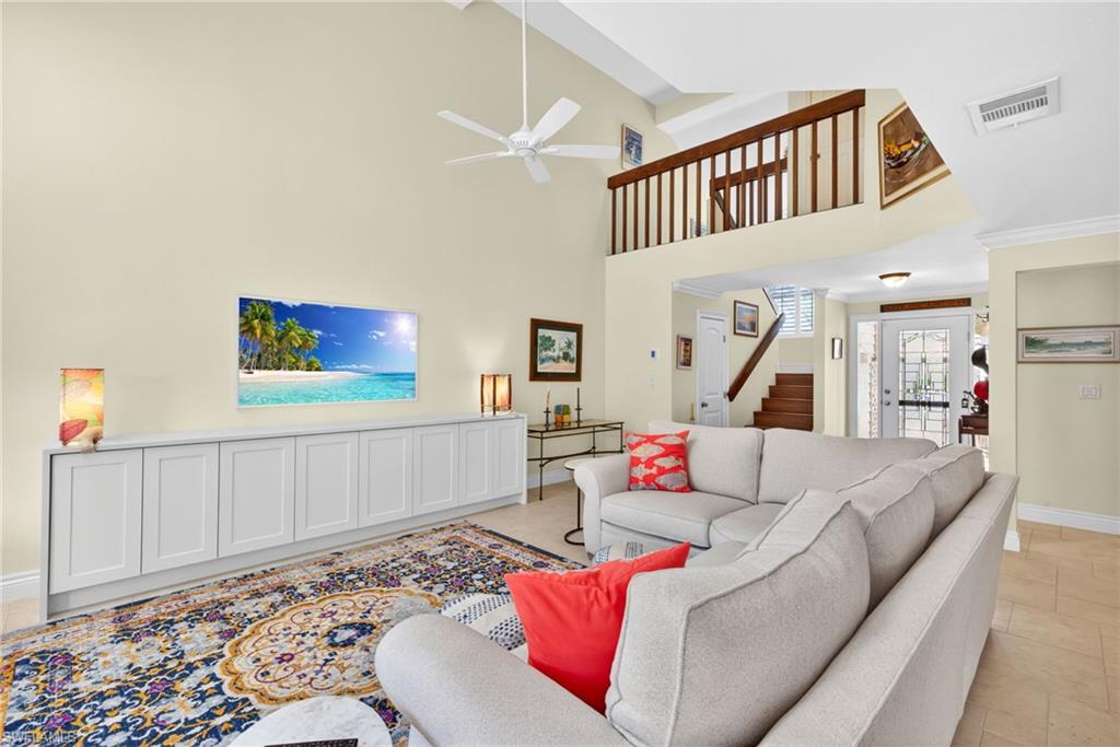 4030 Crayton Road, Unit C2 Naples, FL 34103 - Photo 16 of 32 a living room with furniture and a wooden floor
