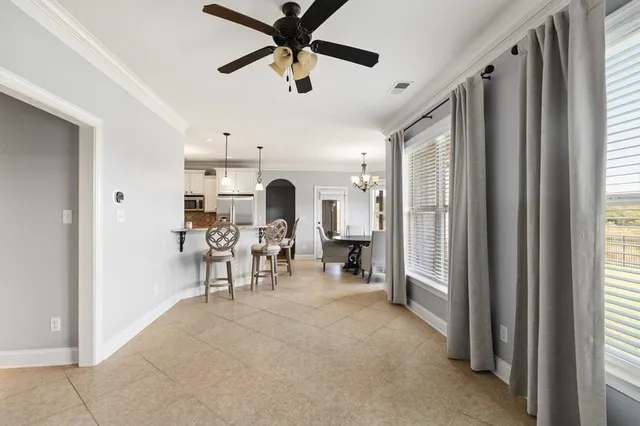a view of a livingroom with furniture and a window