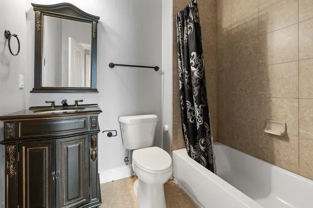 a bathroom with a toilet a sink and a bathtub