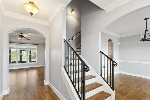 a view of an entryway with wooden floor