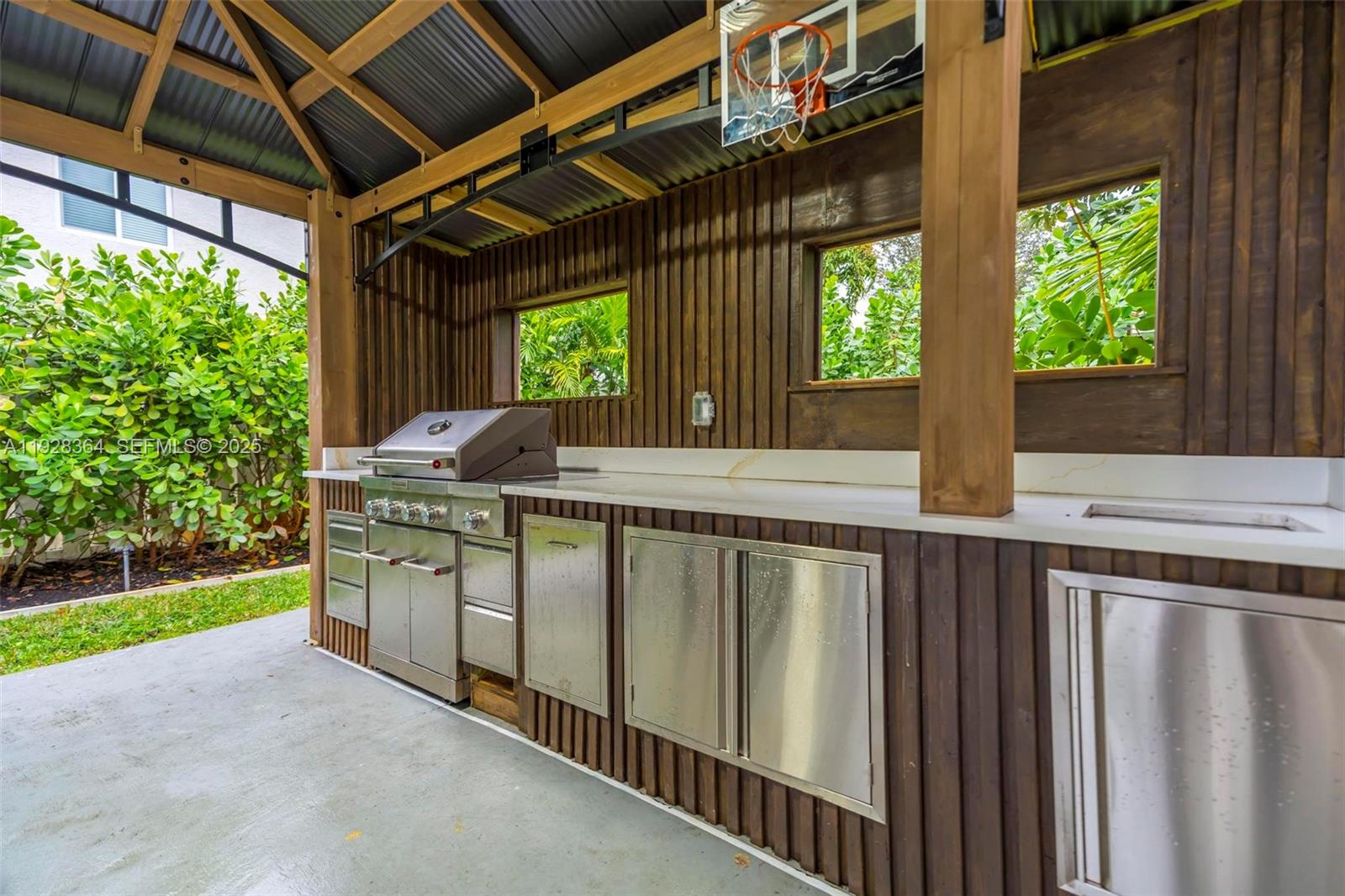 16437 Southwest 28th Street Miramar, FL 33027 - Photo 11 of 34 a house view with a garden space