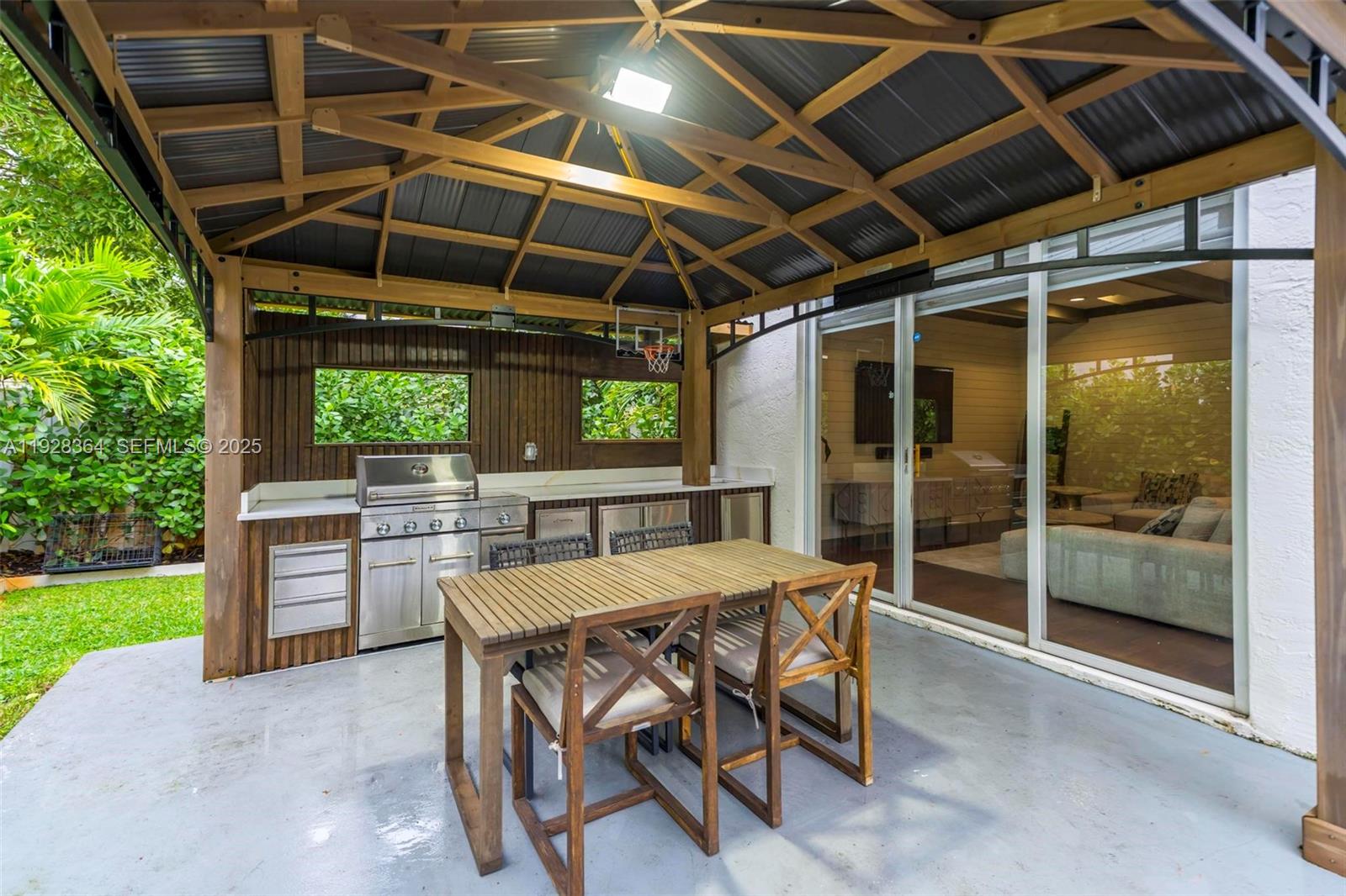 16437 Southwest 28th Street Miramar, FL 33027 - Photo 12 of 34 a patio with a table and chairs