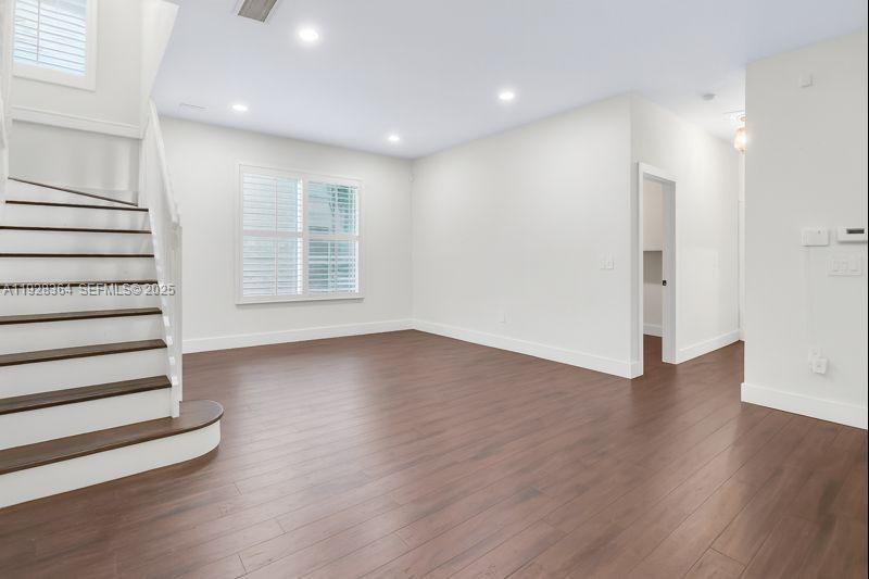 16437 Southwest 28th Street Miramar, FL 33027 - Photo 15 of 34 an empty room with wooden floors and window