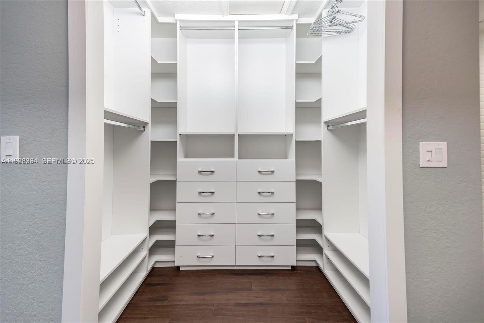 16437 Southwest 28th Street Miramar, FL 33027 - Photo 19 of 34 a view of walk in closet with empty racks