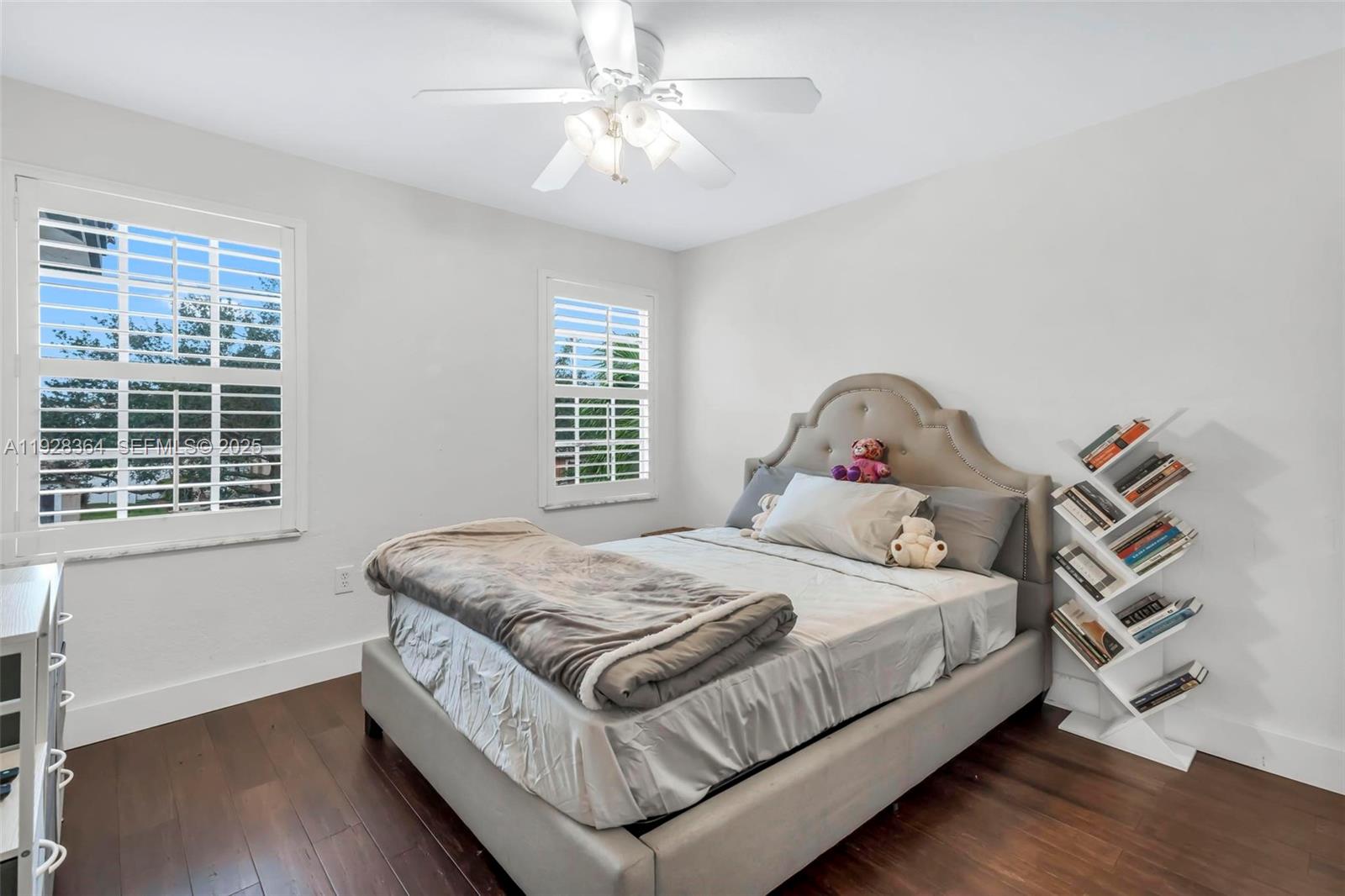 16437 Southwest 28th Street Miramar, FL 33027 - Photo 21 of 34 a bedroom with a bed and a window