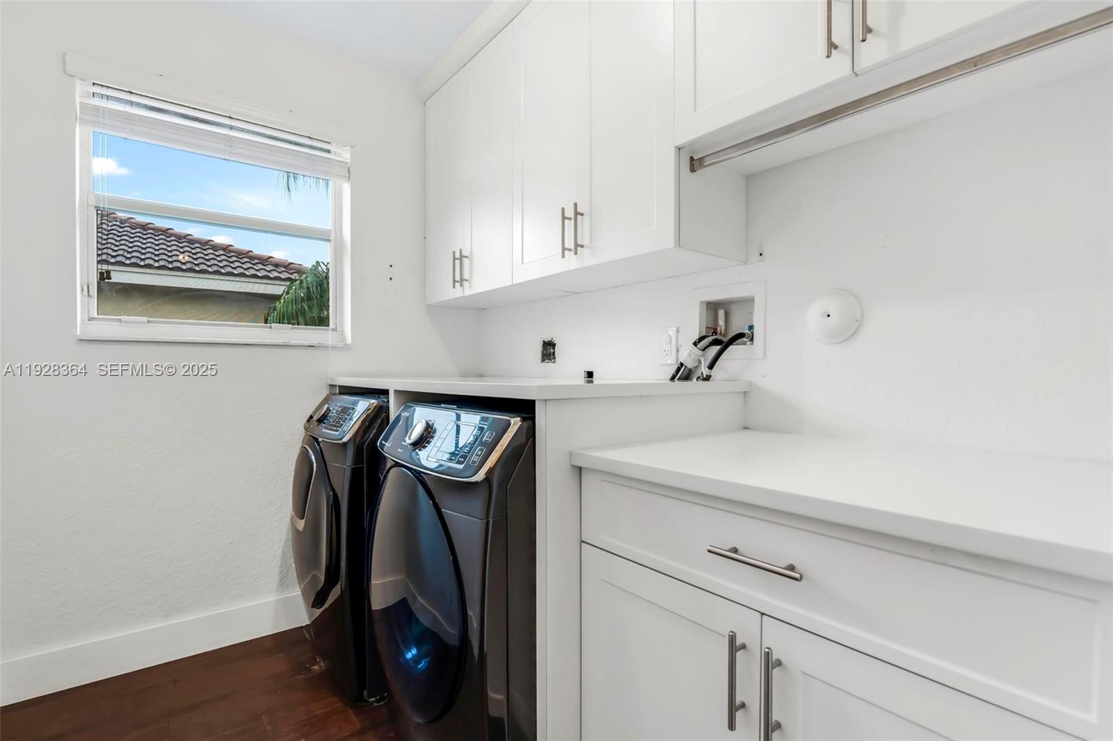 16437 Southwest 28th Street Miramar, FL 33027 - Photo 26 of 34 a view of walk in closet with clothes and shoes