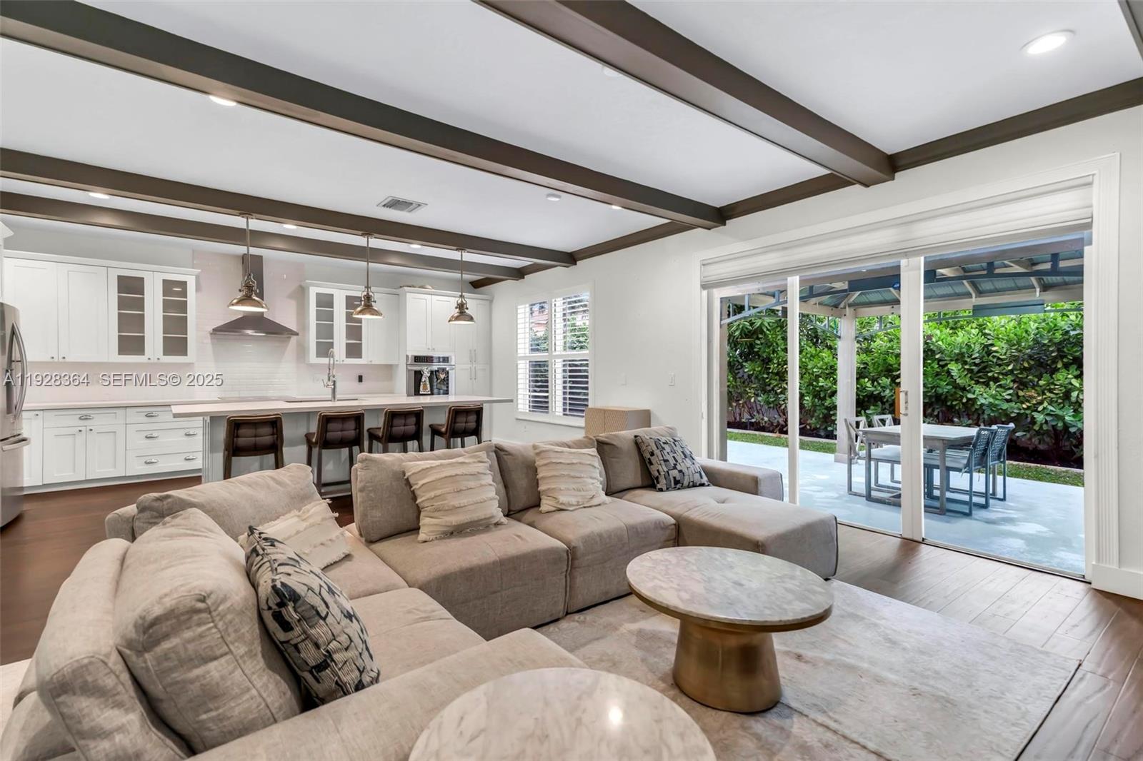 16437 Southwest 28th Street Miramar, FL 33027 - Photo 7 of 34 a living room with furniture and a large window