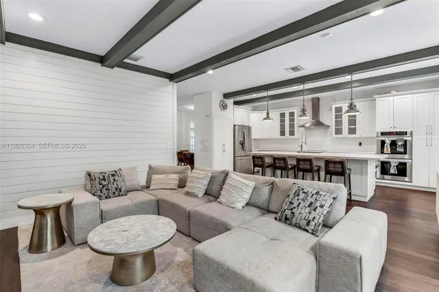 a living room with furniture and a table