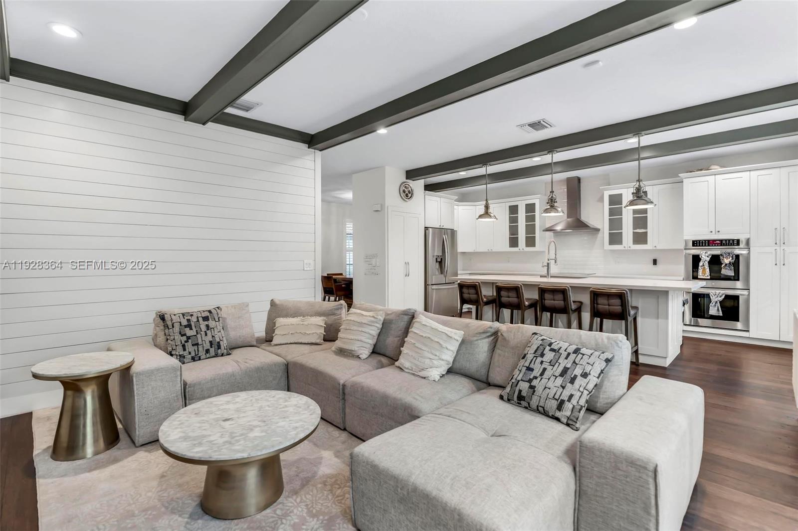 16437 Southwest 28th Street Miramar, FL 33027 - Photo 8 of 34 a living room with furniture and a table