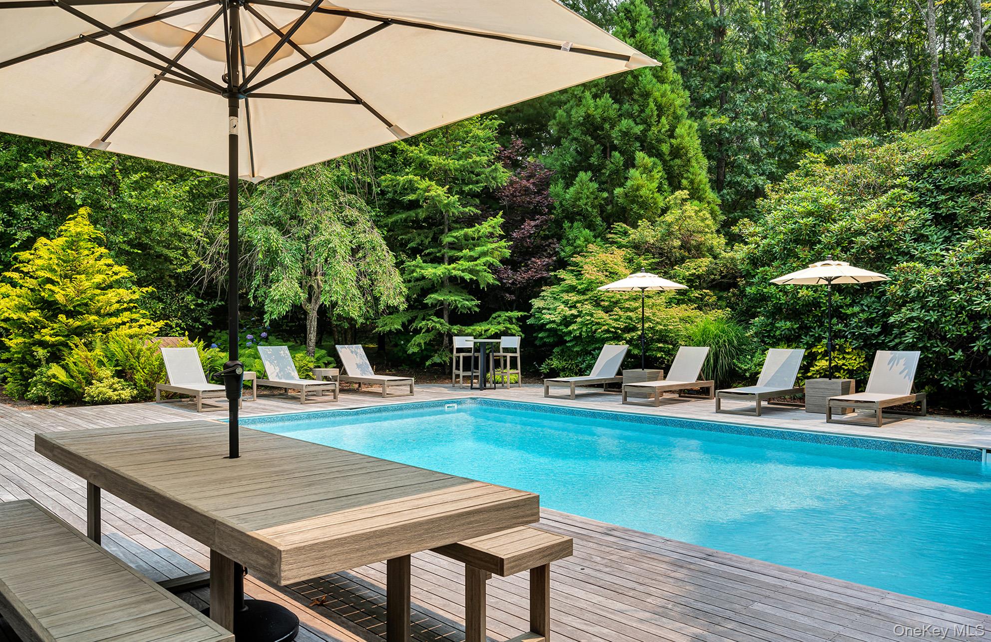 8 Fox Glove Road East Hampton, NY 11937 - Photo 14 of 15 a view of a swimming pool with a patio