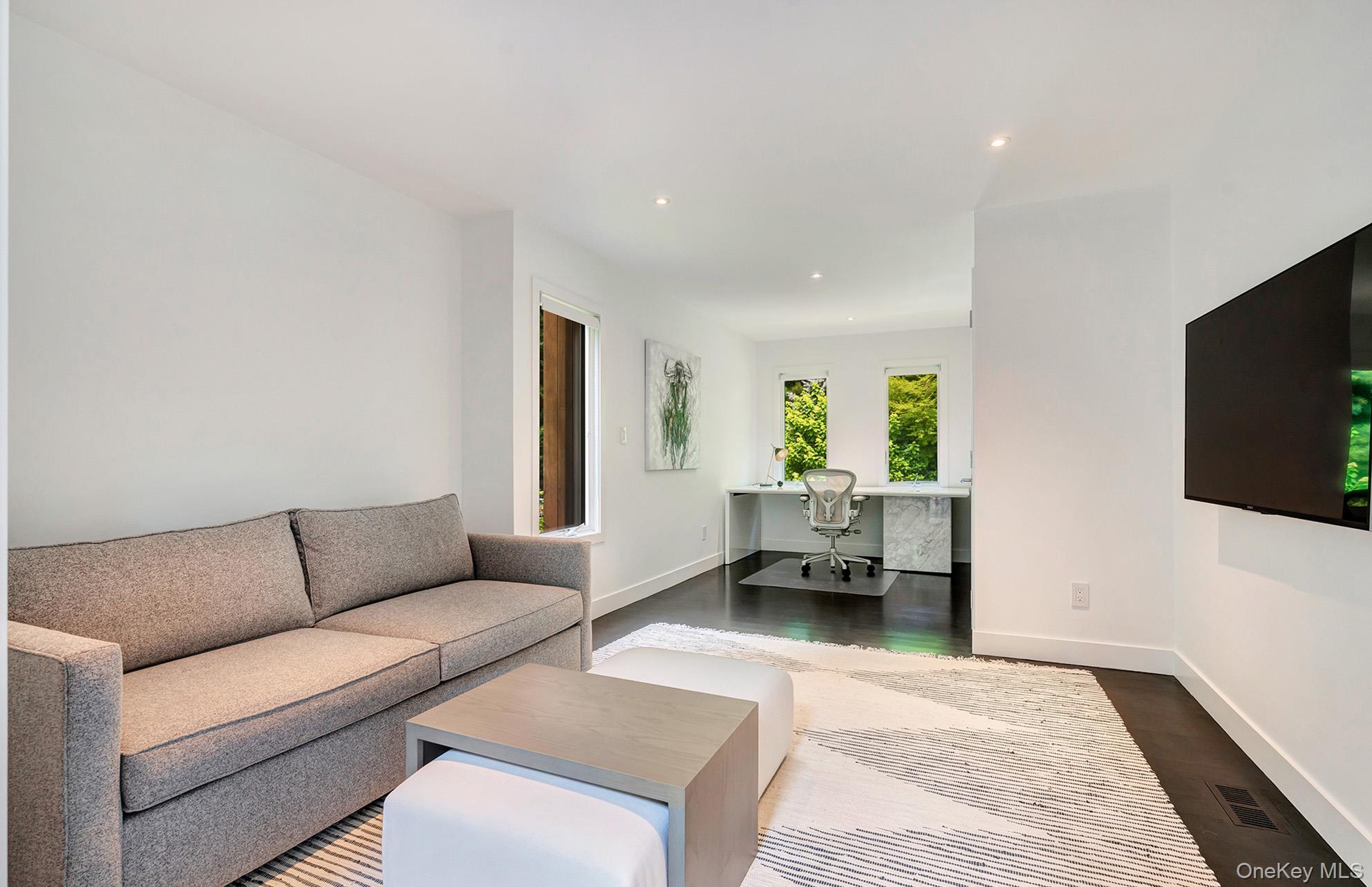 8 Fox Glove Road East Hampton, NY 11937 - Photo 9 of 15 a living room with furniture and a flat screen tv