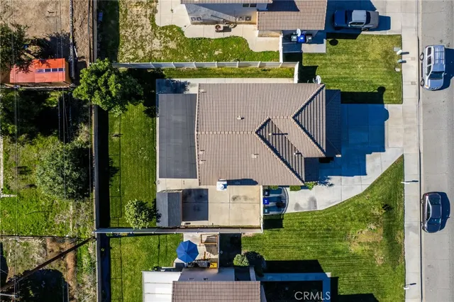 an aerial view of a house with a swimming pool