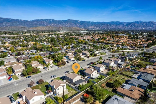 an aerial view of residential house and sandy dunes