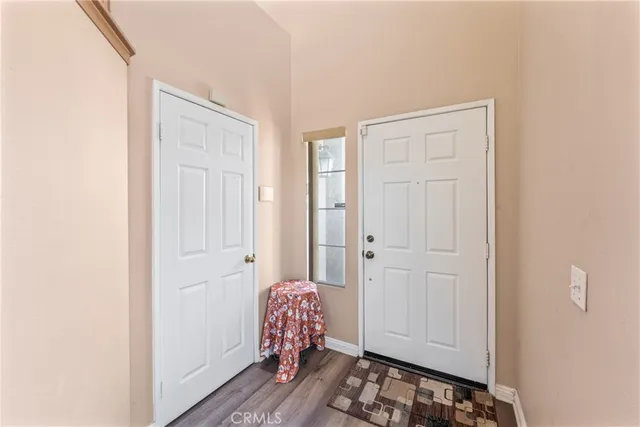 a view of room with wooden floor and closet