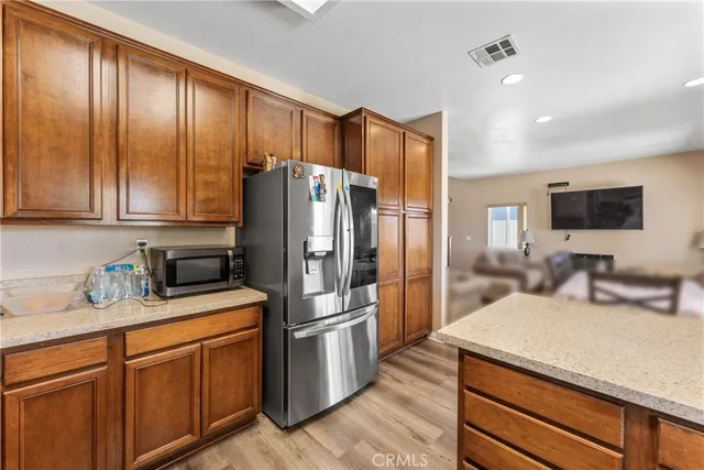 a kitchen with a refrigerator sink and microwave