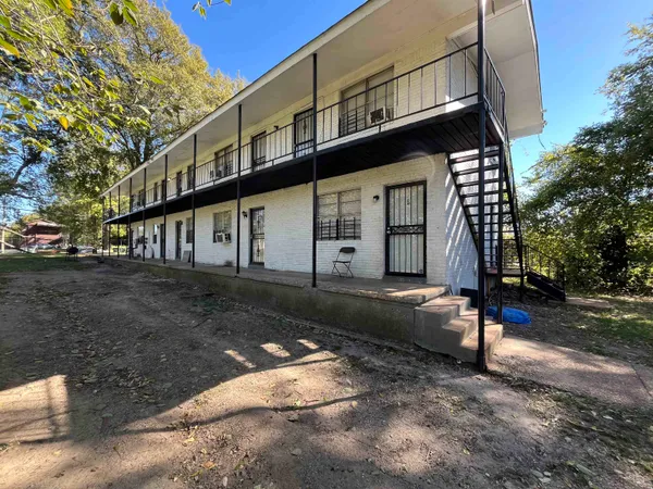 a view of a house with a street