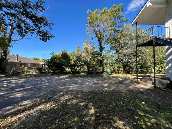 a view of a backyard with green space