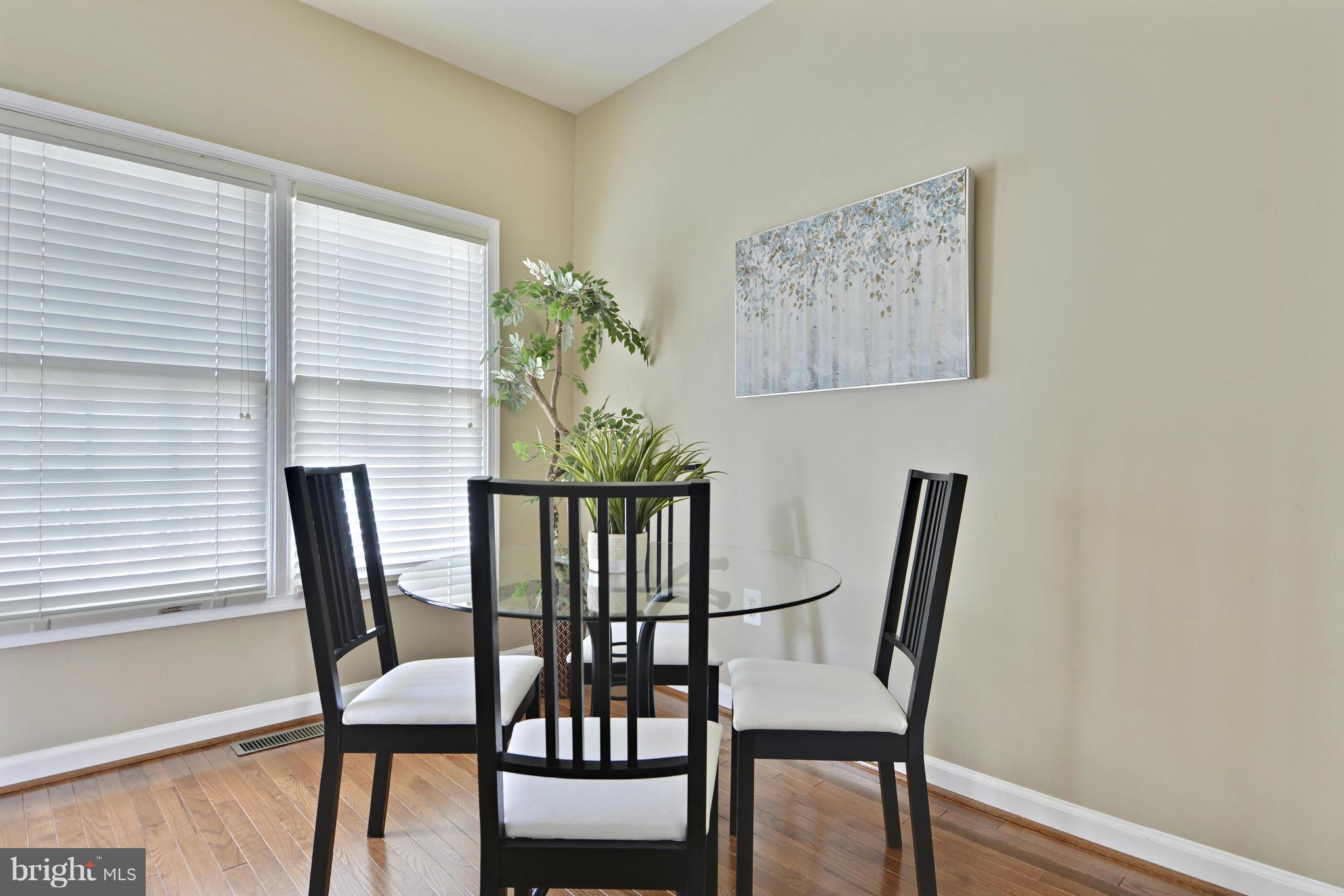 8523 2nd Avenue Silver Spring, MD 20910 - Photo 11 of 30 a view of a dining room with furniture and wooden floor