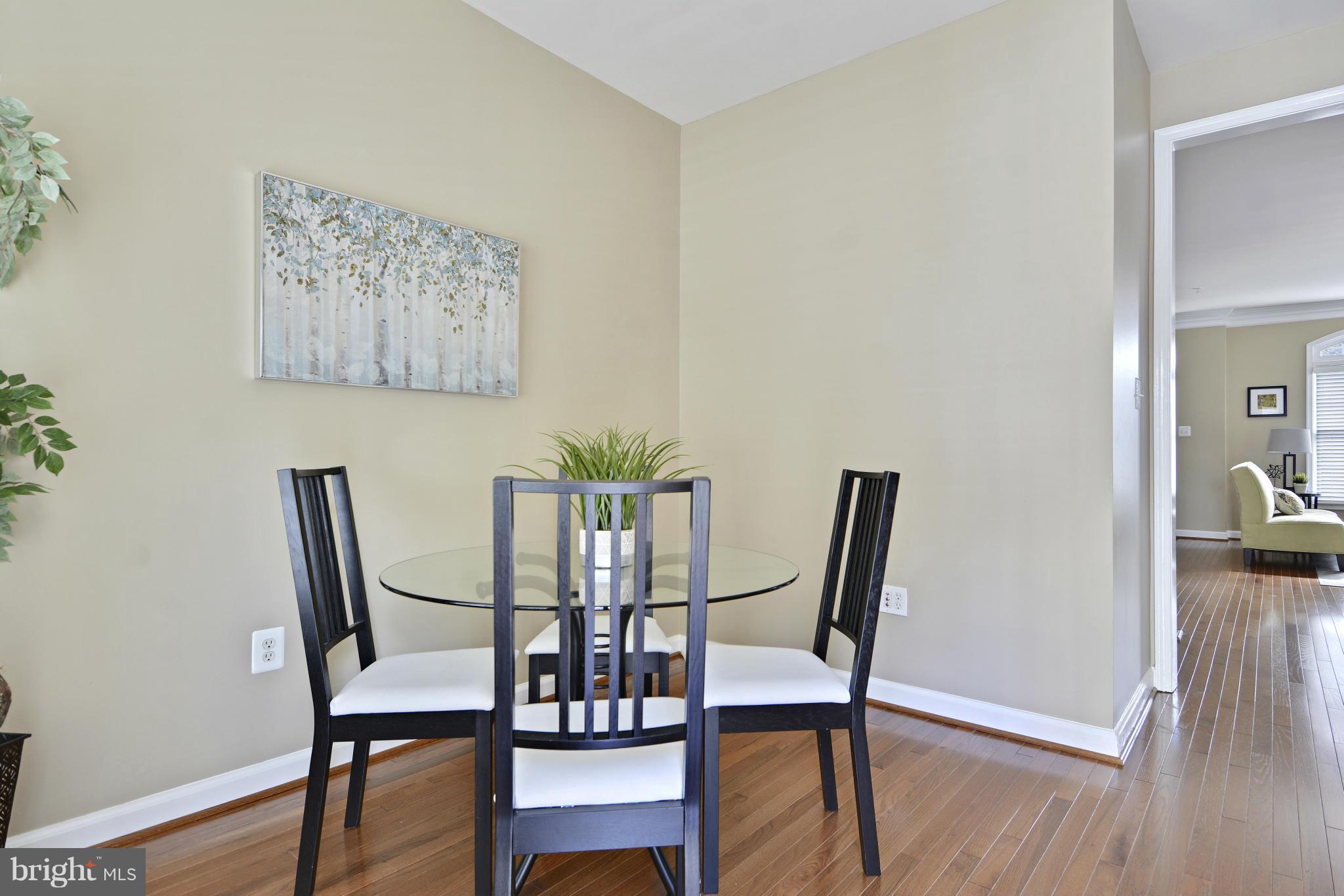 8523 2nd Avenue Silver Spring, MD 20910 - Photo 12 of 30 a view of a dining room with furniture and wooden floor