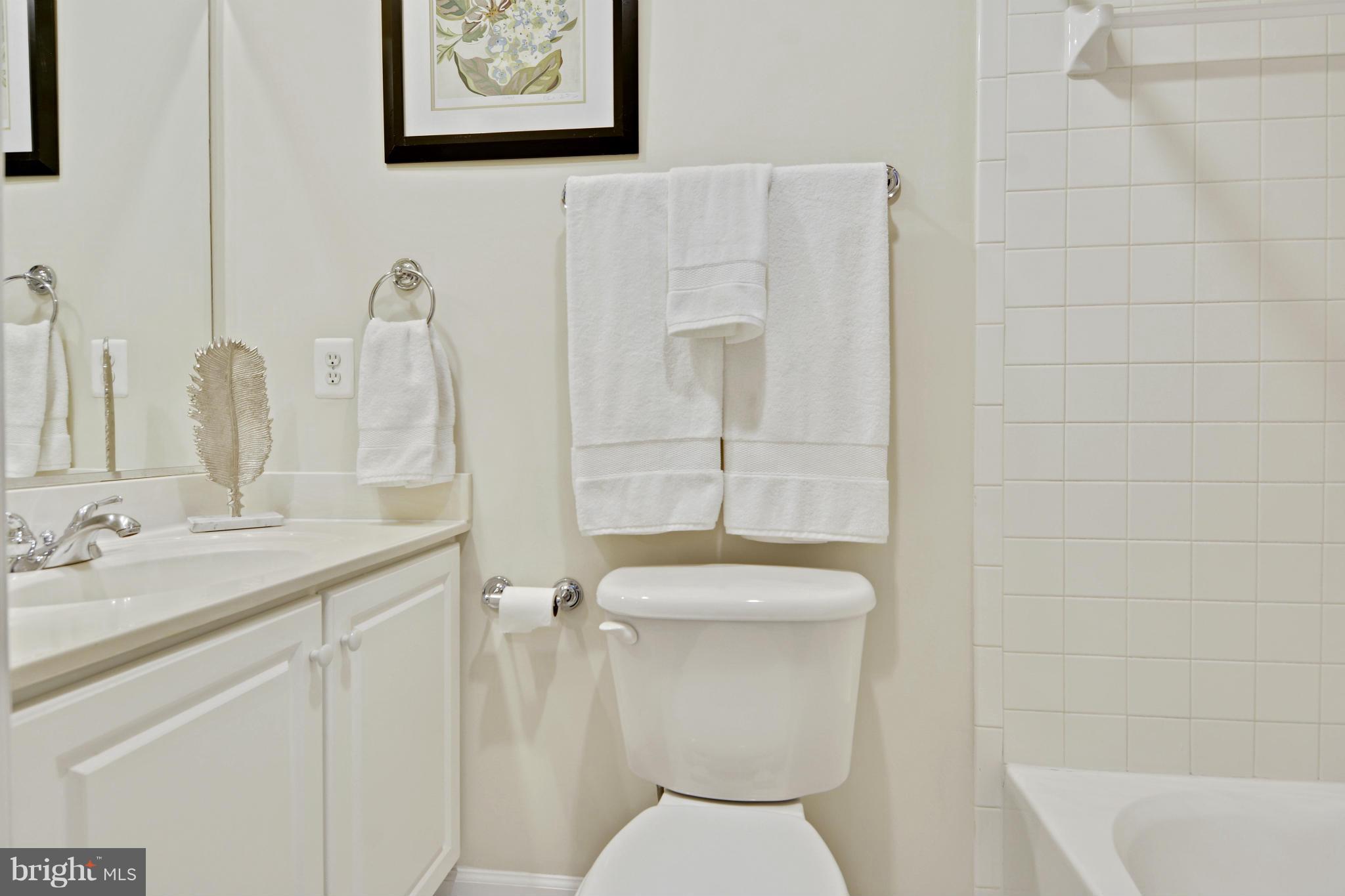 8523 2nd Avenue Silver Spring, MD 20910 - Photo 15 of 30 a bathroom with a toilet sink and mirror