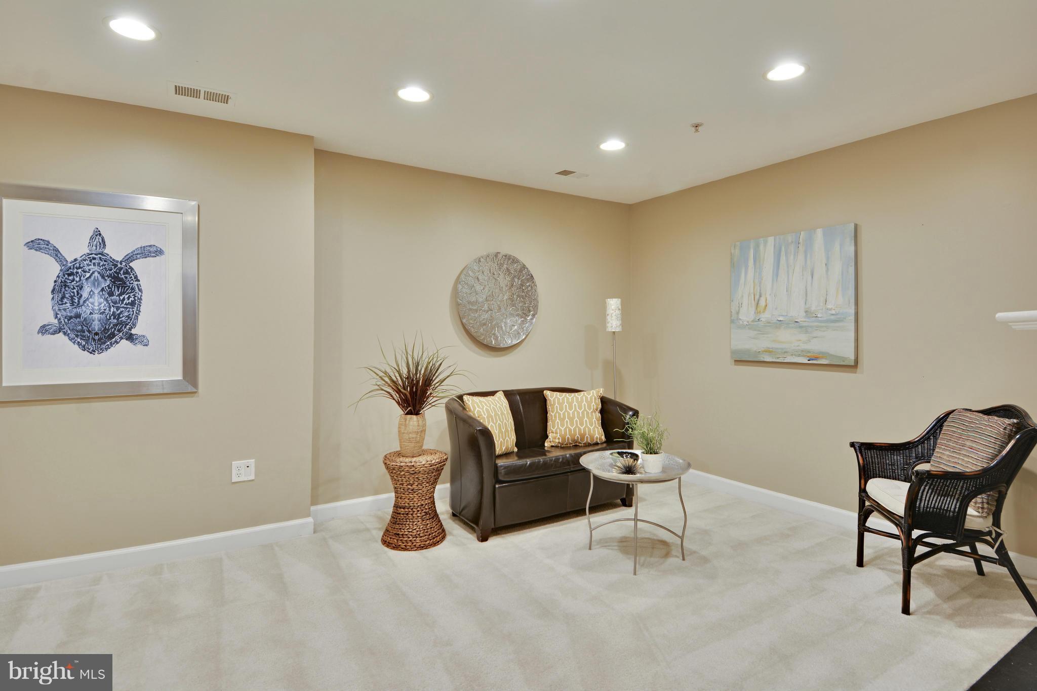 8523 2nd Avenue Silver Spring, MD 20910 - Photo 17 of 30 a living room with furniture and a chair