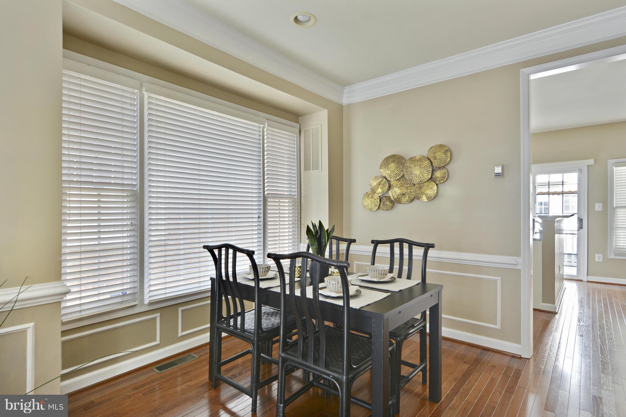 8523 2nd Avenue Silver Spring, MD 20910 - Photo 6 of 30 a view of a dining room with furniture window and wooden floor
