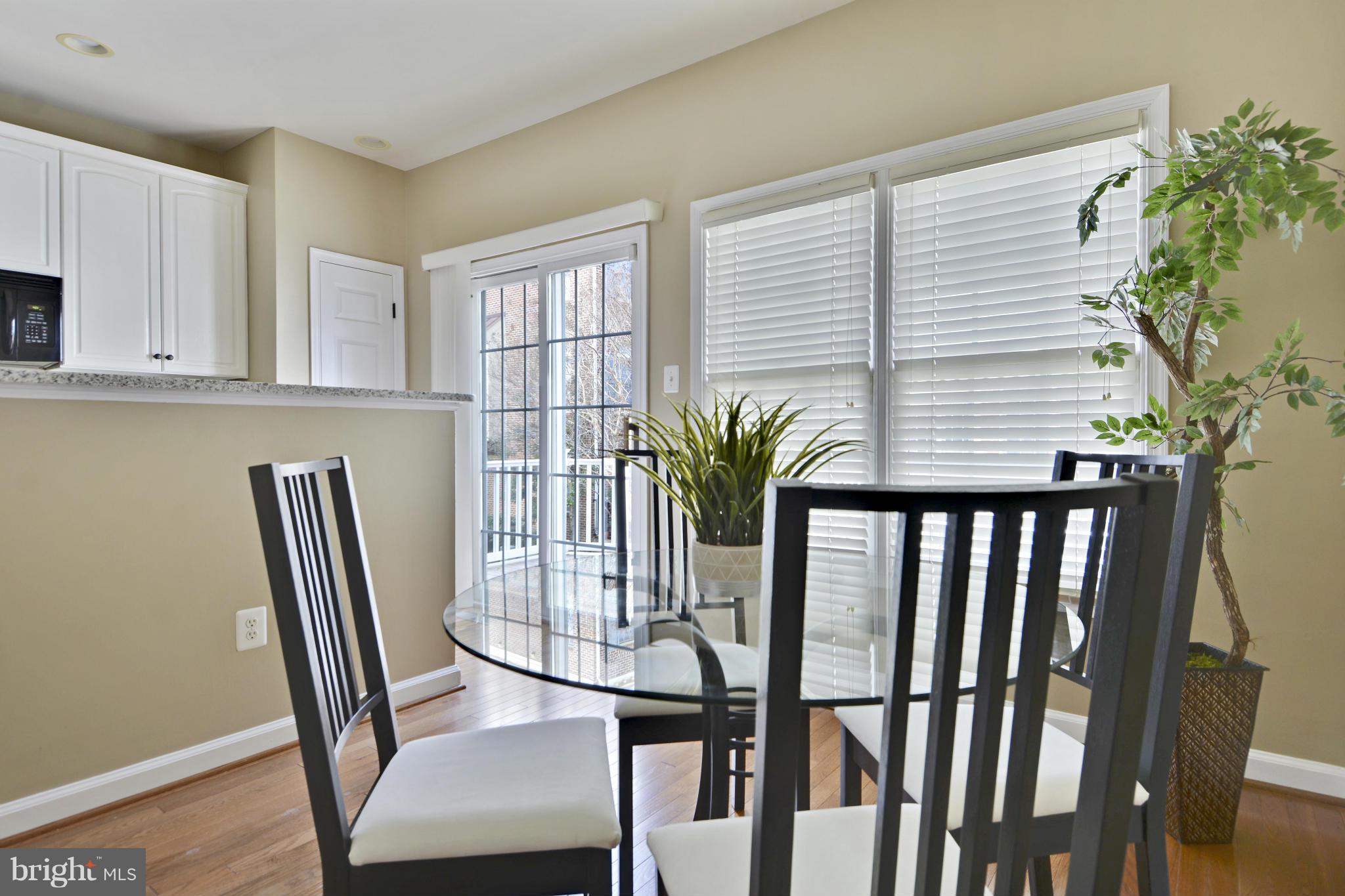 8523 2nd Avenue Silver Spring, MD 20910 - Photo 10 of 30 a view of a dining room with furniture window and wooden floor