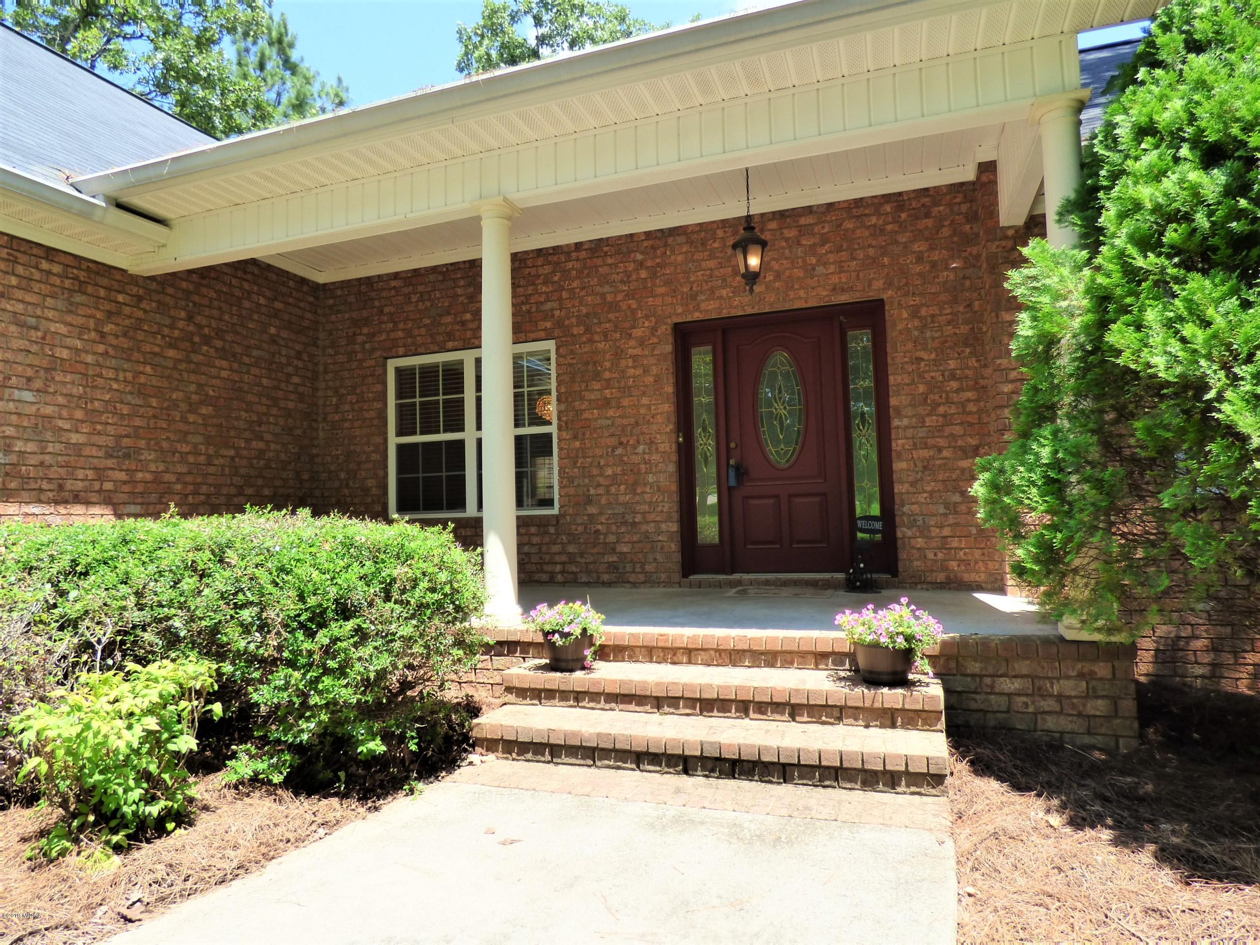 222 Ridge Point Way Macon, GA 31220 - Photo 2 of 19 a front view of a house with a yard