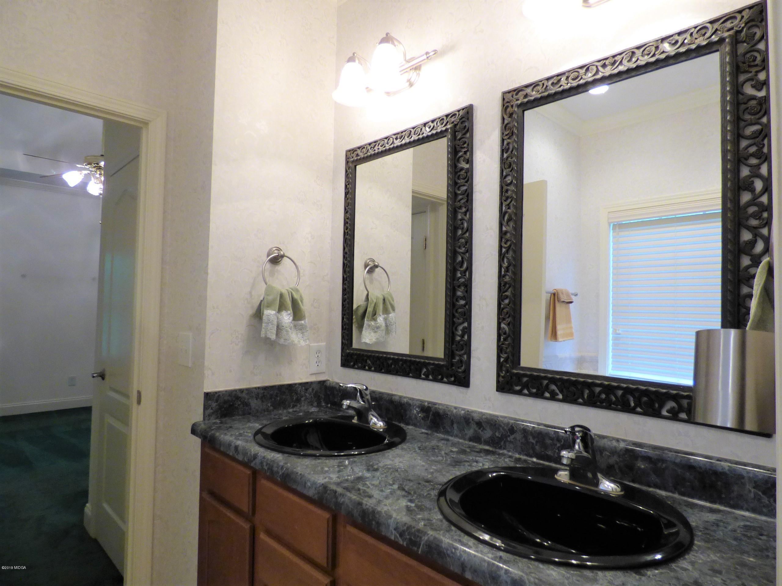 222 Ridge Point Way Macon, GA 31220 - Photo 13 of 19 a bathroom with a sink and a mirror