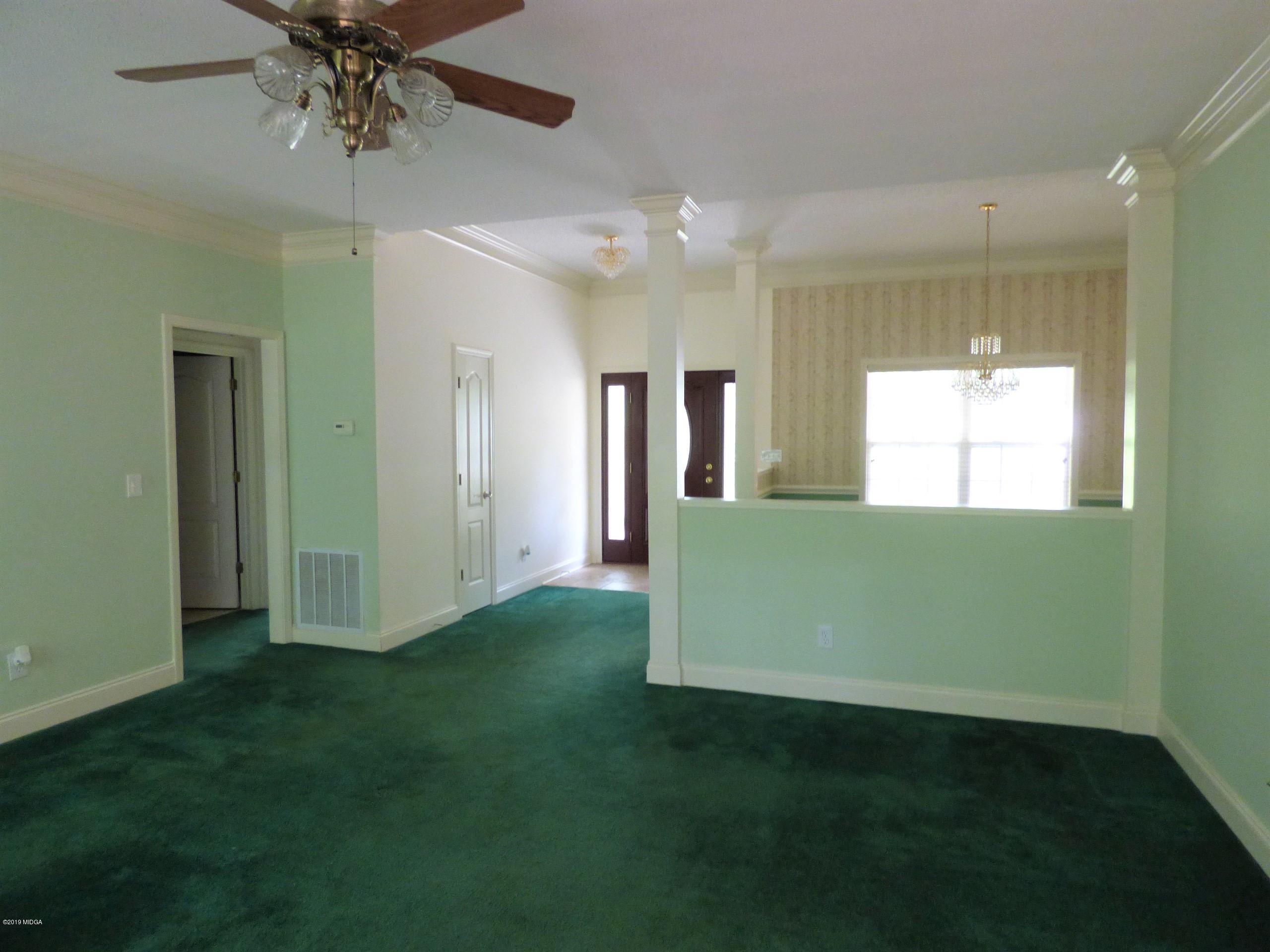 222 Ridge Point Way Macon, GA 31220 - Photo 4 of 19 a view of an empty room with a window