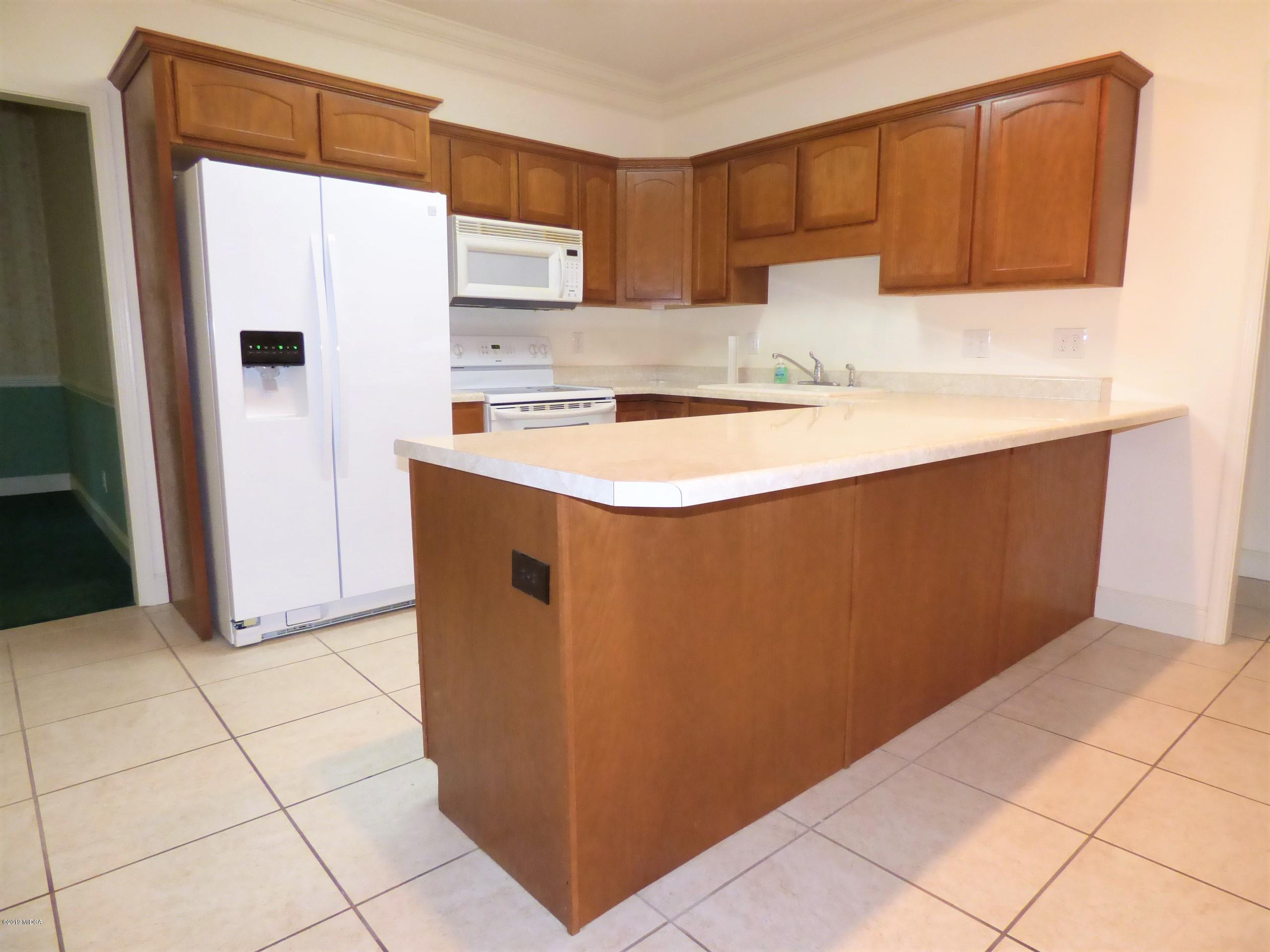 222 Ridge Point Way Macon, GA 31220 - Photo 8 of 19 a kitchen with stainless steel appliances a refrigerator and a stove