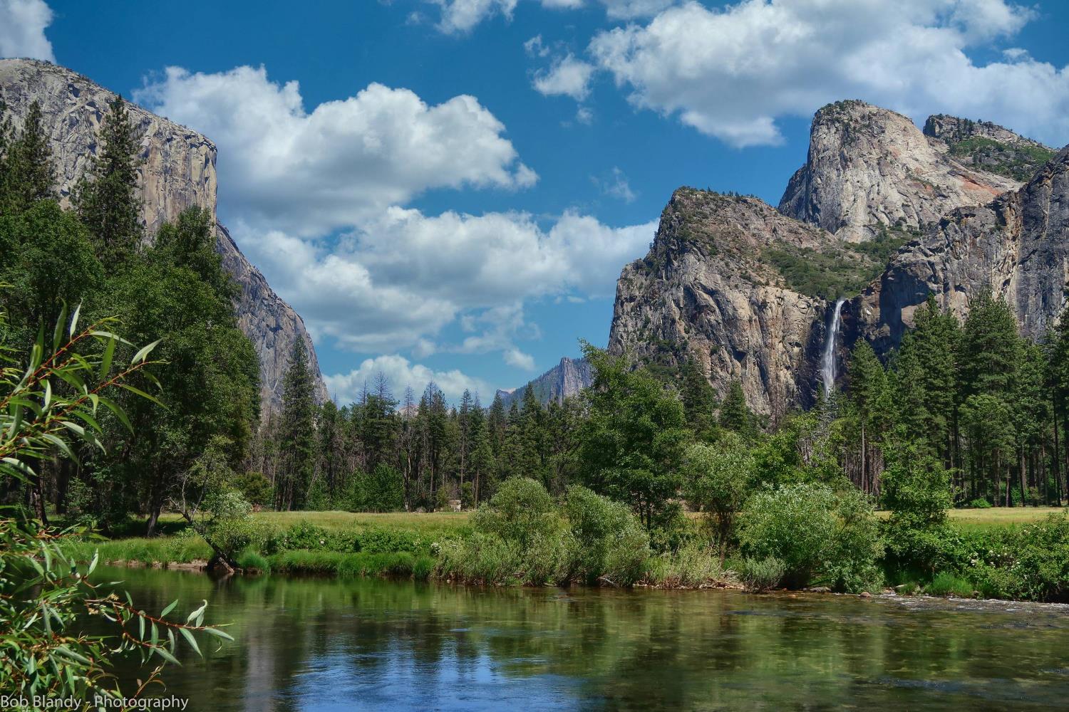 8041 Chilnualna Falls Road Wawona, CA 95389 - Photo 44 of 46 a view of a lake with a building in the background