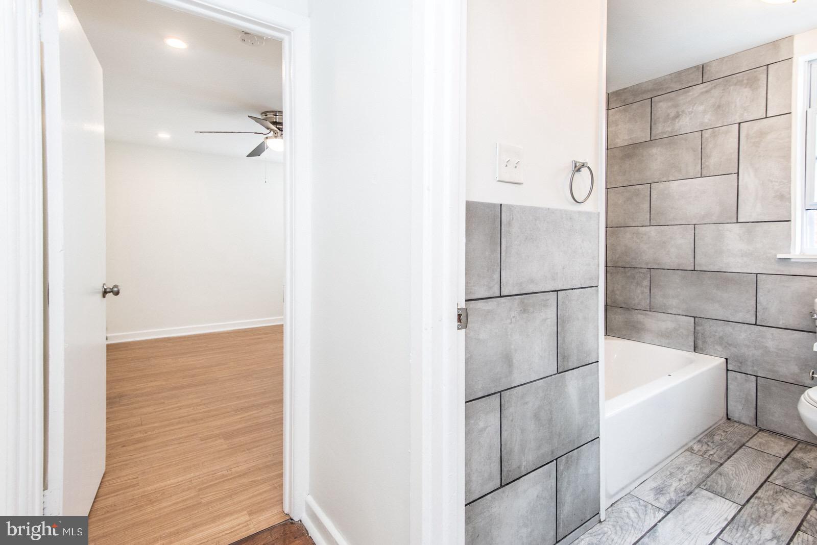 7934 Gilbert Street, Unit 2 Philadelphia, PA 19150 - Photo 4 of 6 a bathroom with a bathtub