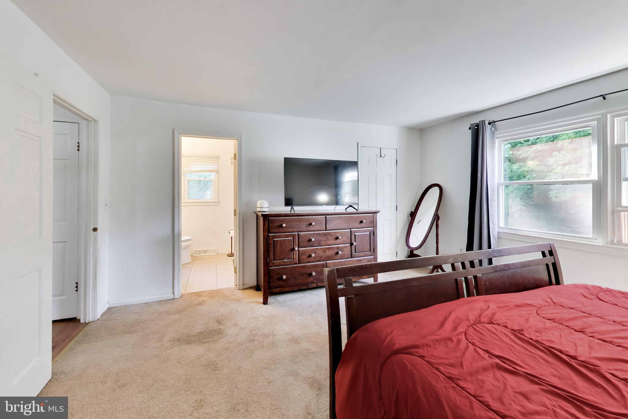 3240 Juniper Lane Huntingtown, MD 20639 - Photo 42 of 48 a bedroom with a bed and a flat screen tv