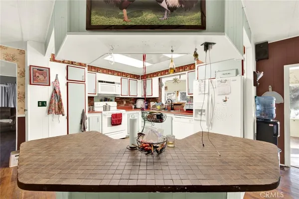 a dining room with table and chairs