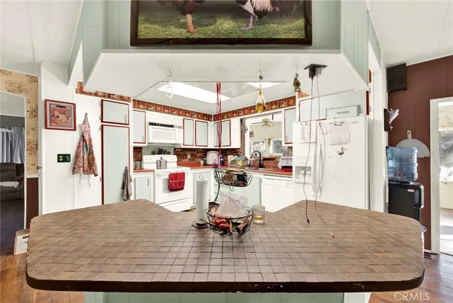 a dining room with table and chairs