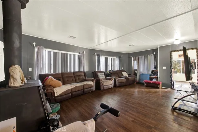 a living room with furniture or couch and a wooden floor