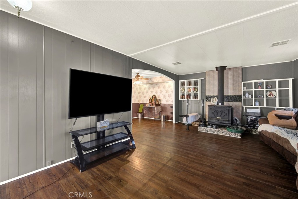 14721 Nevis Road Red Bluff, CA 96080 - Photo 28 of 50 a living room with furniture and a flat screen tv